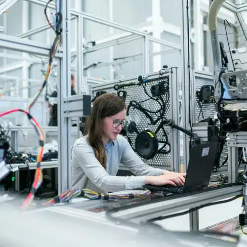 a woman sitting at a computer